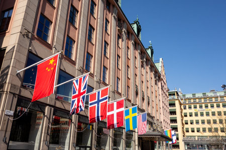 STOCKHOLM, SWEDEN - APRIL 20, 2019: The famous Haymarket hotel in the centre of Stockholm, Sweden at Hotorget street with a lot of countries flagsのeditorial素材