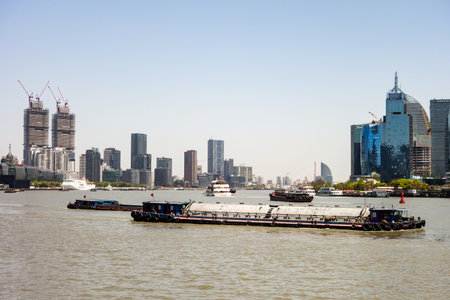 SHANGHAI, CHINA - APRIL 13, 2017: The Huangpu river in Shanghai with a lot of cargo ships...