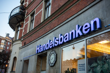 STOCKHOLM, SWEDEN - APRIL 17, 2019: The logo of the Handelsbanken bank on a street in Stockholm, Sweden during the early twilightのeditorial素材