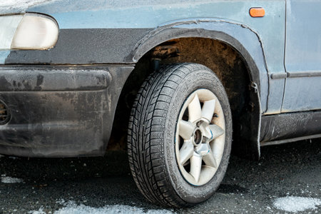 SENOV, CZECH REPUBLIC - DECEMBER 30, 2017: The icy weather, a frozen tyre of a Skoda Felicia car after freezing night on an icy dangerous roadのeditorial素材