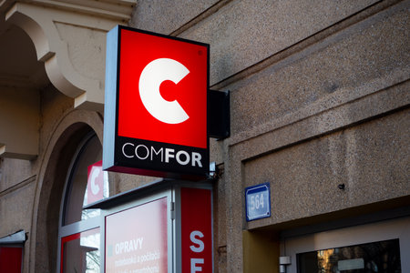 OSTRAVA, CZECHIA - DECEMBER 11, 2019: The banner of a Czech company Comfor which is one of the largest retailers with computer electronics at twilight with enlightened logoのeditorial素材