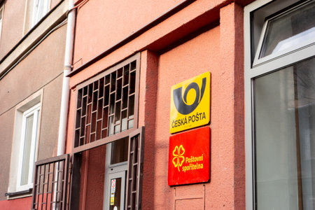 OSTRAVA, CZECHIA - DECEMBER 13, 2019: The signboards of Ceska Posta (Czech Post) company and Postovni sporitelna (Post Bank) in one of their branch officesのeditorial素材