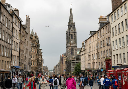 EDINBURGH, SCOTLAND - JULY 29, 2019: Tron Kirk & Royal Mile Market at High Street in Edinburgh with a lot of tourists and people walkingのeditorial素材