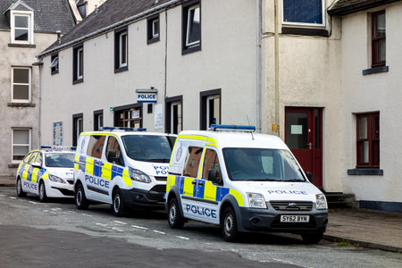 PORTREE, SCOTLAND - AUGUST 4, 2019: Ford and Peugeot police cars in front of the Portree Police...