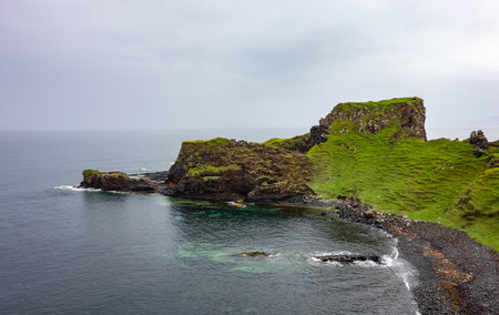 Landscape of Rubha nam Brathairean (Brothers Point) in Isle of Skye in Scotland with reflection of a...