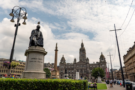 GLASGOW, SCOTLAND - JULY 31, 2019: Statue of James Watt, inventor of steam engine at George Square in front of Glasgow City Councilのeditorial素材