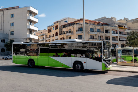 BUGIBBA, MALTA - OCTOBER 26, 2019: Brand new Otokar Kent bus of the Malta Public Transport company at the main bus station at St Pauls Bay providing commuting services for inhabitants and touristsのeditorial素材
