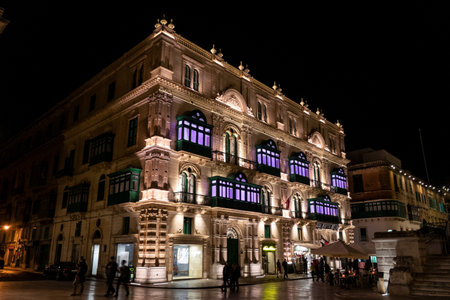 VALLETTA, MALTA - OCTOBER 28, 2019: Palazzo Ferreria building at night illuminated by lights in the centre of Valletta.のeditorial素材