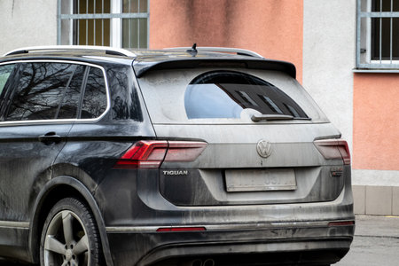 OSTRAVA, CZECHIA - JANUARY 29, 2020: The very dirty and dusty rear part of Volkswagen Tiguan SUV car due to a lot of mud on the roads which were driven because of active lifestyleのeditorial素材