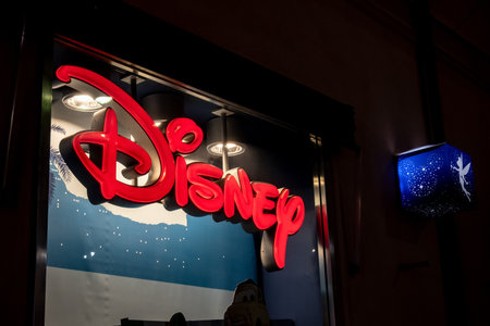 PALERMO, SICILY - FEBRUARY 8, 2020: The logo of the Disney company and the banner with a blue fairy above the entrance to one of its retail shops in Palermo.のeditorial素材