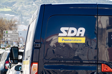 CEFALU, SICILY - FEBRUARY 11, 2020: The rear view of a blue post office van of the SDA Posta...