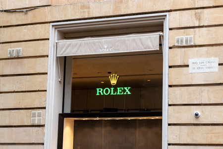 VALLETTA, MALTA - OCTOBER 29, 2019: The storefront with a logo of luxury Rolex watches on a window glassのeditorial素材