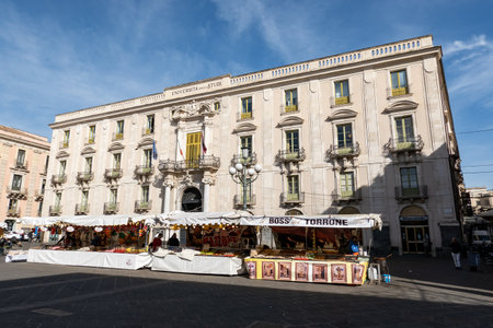 CATANIA, SICILY - FEBRUARY 12, 2020: Building of Universita degli Studi in Catania, Sicily, Italy with marketplaceのeditorial素材