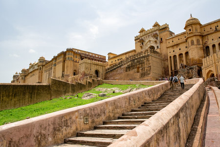JAIPUR, INDIA - JULY 18, 2013: A staircase to Amber Fort in Jaipur, India with tourists going...