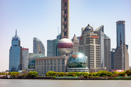 SHANGHAI, CHINA - APRIL, 13, 2019: Cityscape and detail of bottom part of skyscrapers in Shanghai viewed from historical Bund district.のeditorial素材