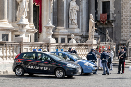 CATANIA, SICILY - FEBRUARY 13, 2020: Fiat Grande Punto cars of Carabinieri and Sicilian police (Polizia) departments in Catania with policemenのeditorial素材