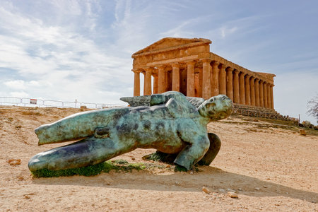 The whole Ancient Statue of the Fallen Icarus in the front of the Tempio della Concordia in Valley of the Temples near Agrigento, Sicily, Italyのeditorial素材