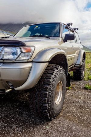 Detail of a SUV 4WD car with extreme all-terrain tyres in Icelandic landscape