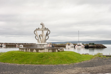 HOLMAVIK, ICELAND - JULY 7, 2014: Seidur art sculpture in the center of Holmavik city in Iceland with cloudy skyのeditorial素材