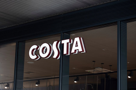 ABERDEEN, SCOTLAND - AUGUST 11, 2019: The storefront with a logo of the Costa cafeteria and glass windowsのeditorial素材