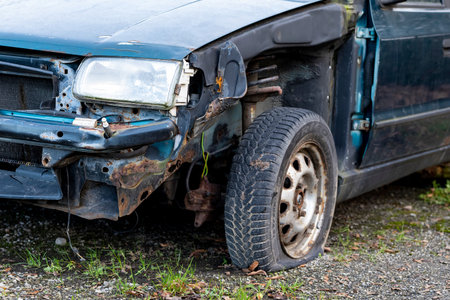 SENOV, CZECH REPUBLIC - DECEMBER 29, 2020: A detail of a frontal part of blue Skoda Felicia car damaged in serious traffic accident with flat tyre and bumper missingのeditorial素材