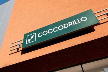 HAVIROV, CZECHIA - SEPTEMBER 12, 2019: The logo of Coccodrillo clothing shop which is providing fashion for kids and children in dynamic perspective viewのeditorial素材