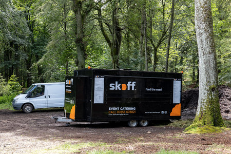 SCOTLAND - AUGUST 10, 2019: The caravan store and Ford Transit van of the Skoff Event Catering company in a forest providing snacks to customersのeditorial素材
