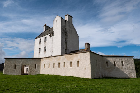 Perspective view of white Corgarff Castle, Scotland at nice sunny afternoon with blue skyのeditorial素材