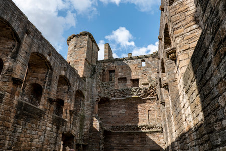 Counrtyard with brick walls in Linlithgow Palace, Scotland, UK at sunsetのeditorial素材