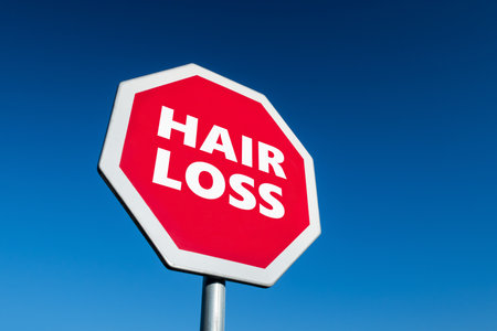 Stop traffic sign with text HAIR LOSS to prevent alopecia diseaseの写真素材