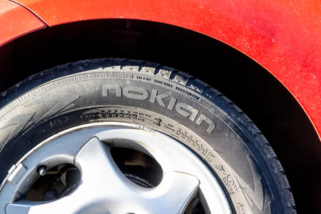 OSTRAVA, CZECH REPUBLIC - MAY 11, 2021: The Nokian rubber tyre mounted on a red carのeditorial素材