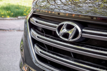 OSTRAVA, CZECH REPUBLIC - MAY 4, 2021: The front grill and hood of brown Hyundai Tucson SUV with a badge of the carmakerのeditorial素材