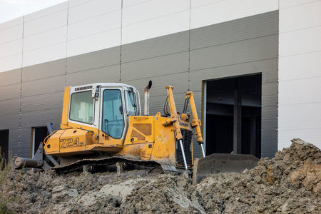 OSTRAVA, CZECH REPUBLIC - AUGUST 16, 2020: Yellow Liebherr 742 XL excavator on working site building a new storehouseのeditorial素材