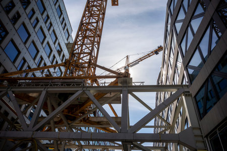 STOCKHOLM, SWEDEN - APRIL 19, 2019: Construction crane of Vasakronan company used in Stockholm, Swedenのeditorial素材