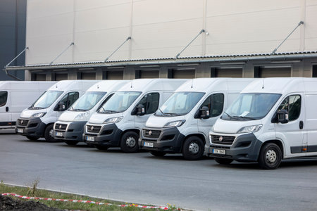 OSTRAVA, CZECH REPUBLIC - AUGUST 16, 2020: Several white Fiat Ducato vans loading cargo at Fedex depotのeditorial素材