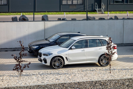 OSTRAVA, CZECH REPUBLIC - MAY 31, 2021: The white BMW X5 G05 luxury SUV and 5-Series cars at a dealership presented for the test driveのeditorial素材