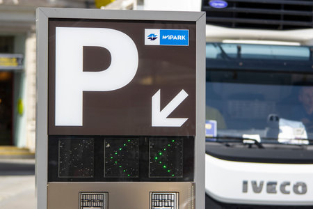 VIENNA, AUSTRIA - JULY 27, 2021: Parking meter machine WiPark in centre of Vienna, Austria with Iveco LCV in the backgroundのeditorial素材