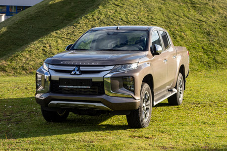 OSTRAVA, CZECH REPUBLIC - MAY 8, 2021: Brand new brown Mitsubishi L200 pickup presented by dealership ready to be sold or taken on a test driveのeditorial素材