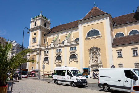 VIENNA, AUSTRIA - JULY 28, 2021: Schottenkirche church in centre of Vienna capital city with cars parked in front of itのeditorial素材