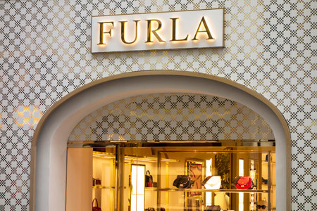 VIENNA, AUSTRIA - JULY 28, 2021: Storefront of Furla boutique shop which sells fashionable accessories like luxury bags for women in Viennaのeditorial素材