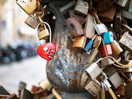 LECCE, ITALY - OCTOBER 27, 2021: Love locks locked on a bridge in Lecce, Italy with the names of loversのeditorial素材
