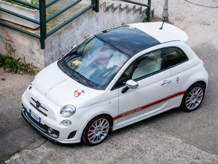 OSTUNI, ITALY - OCTOBER 28, 2021: White sporty Fiat 500 Abarth 595 stylish retro hatchback typical for Italyのeditorial素材