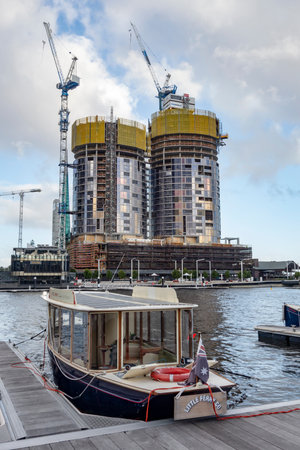 PERTH, WESTERN AUSTRALIA - JULY 16, 2018: Construction of The Towers at Elizabeth Quay luxury apartments with ProBuild cranes