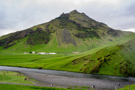 Landscape of Drangshlidarfjall peak and Drangshlidardalur 2 village near Skogafoss waterfall in Icelandの写真素材