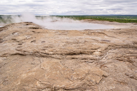 Icelandic landscape near famous Geysir with a steam going from hot landの写真素材