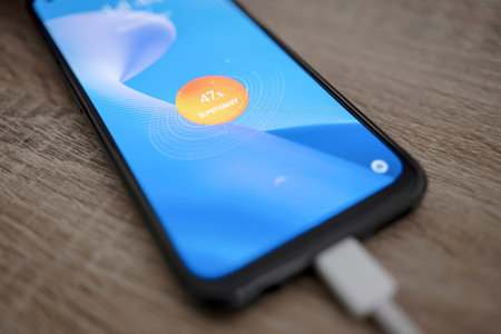 OSTRAVA, CZECH REPUBLIC - FEBRUARY 28, 2022: Quick charging SuperDart on realme 9 Pro Plus smartphone with 65W powerのeditorial素材