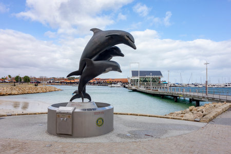 PERTH, WESTERN AUSTRALIA - JULY 16, 2018: Statue of three dolphins as wishing well in AQWA, Sorrento, Perth, Western Australiaのeditorial素材