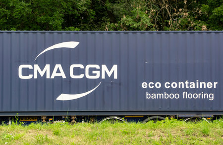 SENOV, CZECH REPUBLIC - JULY 14, 2022: CMA CGM eco containter on a trailer truck wth bamboo flooring