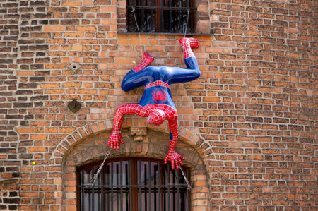 GDANSK, POLAND - JULY 30, 2022: Spiderman figurine at Brama Stagiewna tower in Gdansk, Polandのeditorial素材