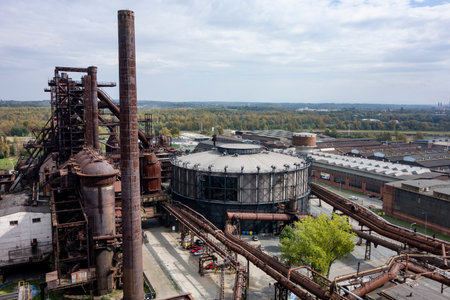 OSTRAVA, CZECHIA - SEPTEMBER 23, 2020: Gong gas tank, tall chimney and historical buildings in Ostrava Dolni Vitkovice district with the technical museumのeditorial素材